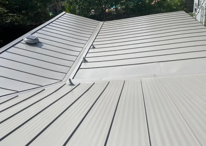 Solar attic fan installed on a metal roof for Roof Ventilation in Gridley